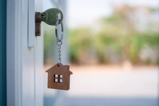 Home insurance – do I need it – house and keys on a desk